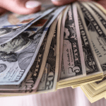 Dollar mostly down after the Fed holds rates 